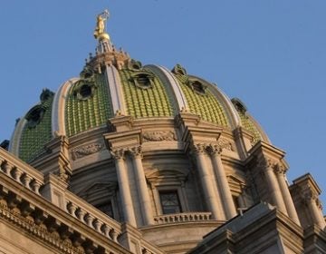 A commission of Pennsylvania lawmakers and state officials is working in Harrisburg to come up with a plan to pay down the state's pension debt. (Matt Rourke/AP Photo)