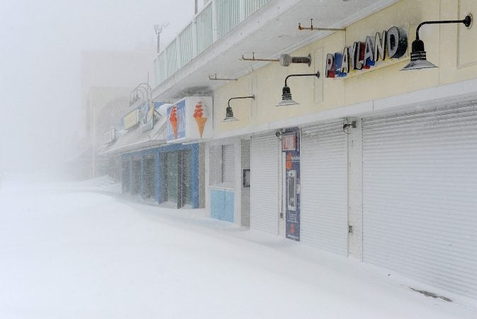 Businesses remained shuttered along the Rehoboth Beach boardwalk as blizzard-like conditions moved in overnight. (Chuck Snyder/for WHYY)