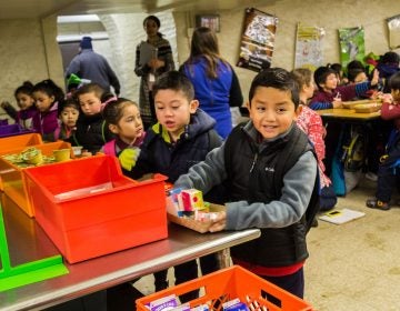 Francis Scott Key Elementary kindergartners and 1st graders picked up breakfast items on Jan. 9 to eat in the cafeteria. Older students eat in classrooms. At a news conference at Key that day, officials celebrated the results of the District's expanded breakfast program. (Darryl Murphy/The Notebook)