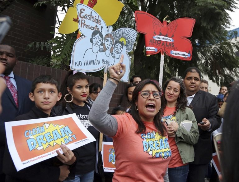 Cristina Jimenez speaks to demonstrators urging the Democratic Party to protect the Deferred Action for Childhood Arrivals Act (DACA) rally outside the office of California Democratic Sen. Dianne Feinstein in Los Angeles Wednesday, Jan. 3, 2018. California has the largest number of people who are affected by the law, also known as the Dream Act. (Reed Saxon/AP Photo)