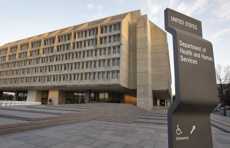 The Department of Health and Human Services building is seen in the evening in Washington