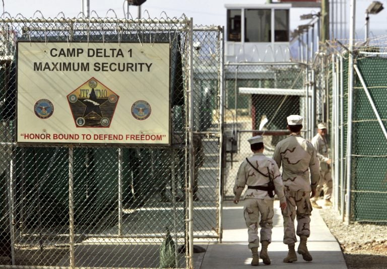 Trump Guantanamo Future FILE - In this June 27, 2006 file photo, reviewed by a U.S. Department of Defense official, U.S. military guards walk within Camp Delta military-run prison, at the Guantanamo Bay U.S. Naval Base, Cuba.