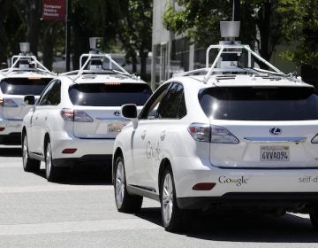 FILE - This May 13, 2014, file photo shows a row of Google self-driving Lexus cars at a Google event outside the Computer History Museum in Mountain View, Calif. California regulators release safety reports filed by 11 companies that have been testing self-driving car prototypes on public roads on Wednesday, Feb. 1, 2017. The papers report the number of times in 2016 that human backup drivers took control from the cars' self-driving software, though companies argue such 