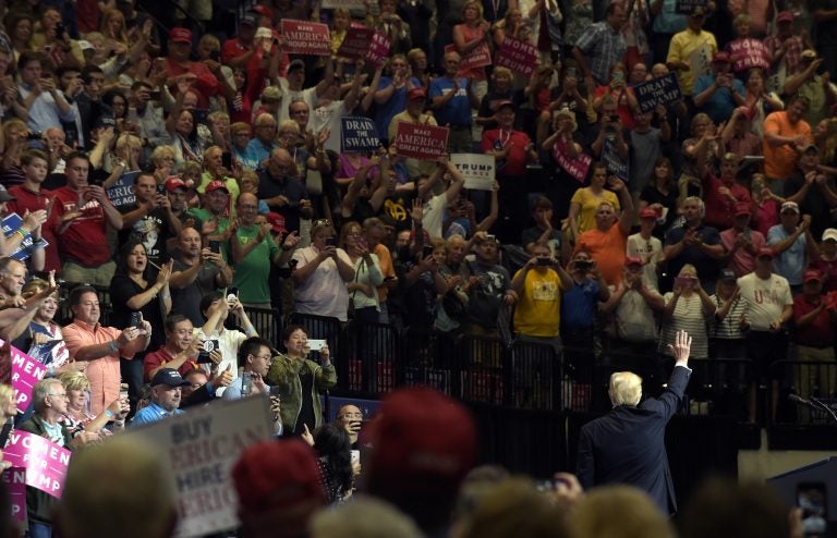 President Donald Trump waves to the crowd after speaking at the U.S. Cellular Center in Cedar Rapids, Iowa, Wednesday, June 21, 2017. This is Trump's first visit to Iowa since the election.