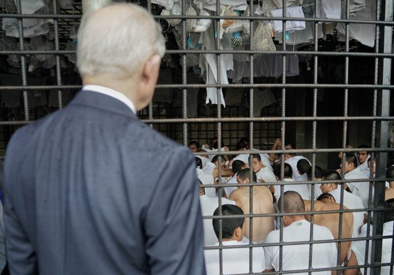 U.S. Attorney General Jeff Sessions stops to look at cell conditions during a tour of a police station and detention center in San Salvador, El Salvador, in July. The city is known as one of the most dangerous in the world. The Trump administration is expected to decide Monday whether to extend temporary protected status to 250,000 Salvadorans in the U.S. (