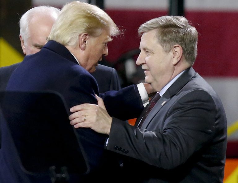 President Donald Trump, left, greets Rick Saccone after speaking at H&K Equipment, Co. on Thursday, Jan. 18, 2018 in Coraopolis, Pa. Saccone is running for the U.S. Congressional seat vacated by Tim Murphy.