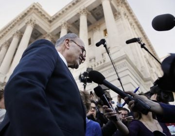 As a bitterly-divided Congress hurtles toward a government shutdown this weekend, Senate Minority Leader Chuck Schumer, D-N.Y., center, speaks to the media outside the Capitol after meeting with President Donald Trump, Friday, Jan. 19, 2018, in Washington.