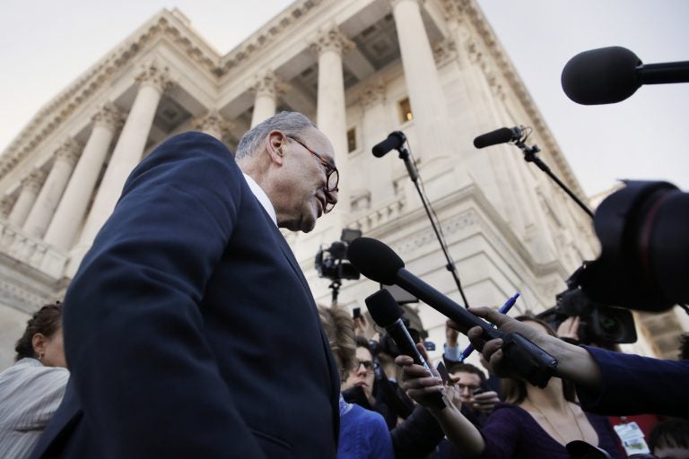 As a bitterly-divided Congress hurtles toward a government shutdown this weekend, Senate Minority Leader Chuck Schumer, D-N.Y., center, speaks to the media outside the Capitol after meeting with President Donald Trump, Friday, Jan. 19, 2018, in Washington.