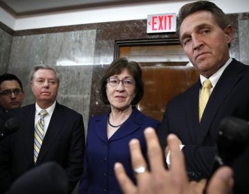 Sen. Lindsey Graham, R-S.C., left, Sen. Susan Collins, R-Maine, and Sen. Jeff Flake, R-Ariz., listen to a question from the media after attending a bipartisan meeting of senators, Monday Jan. 22, 2018, on Capitol Hill in Washington on day three of the government shutdown. (AP Photo/Jacquelyn Martin)