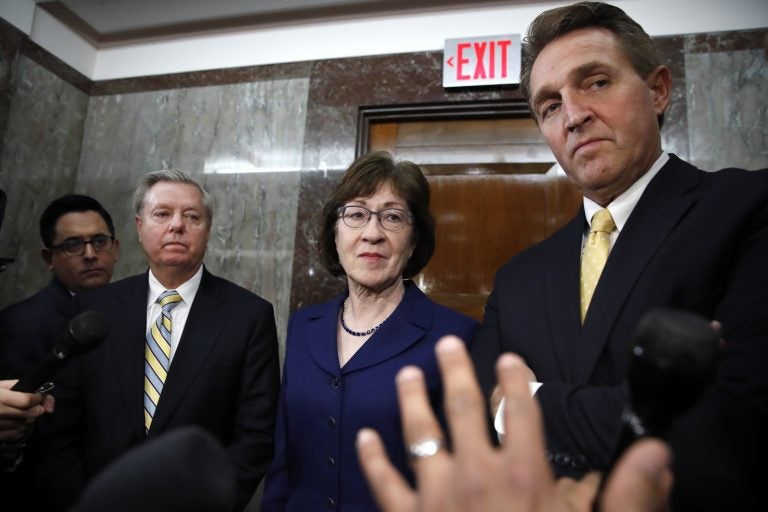 Sen. Lindsey Graham, R-S.C., left, Sen. Susan Collins, R-Maine, and Sen. Jeff Flake, R-Ariz., listen to a question from the media after attending a bipartisan meeting of senators, Monday Jan. 22, 2018, on Capitol Hill in Washington on day three of the government shutdown. (AP Photo/Jacquelyn Martin)