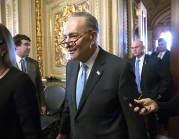 Senate Minority Leader Chuck Schumer, D-N.Y., heads to the chamber with fellow Democrats for a procedural vote aimed at reopening the government, at the Capitol in Washington, Monday, Jan. 22, 2018.