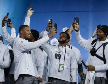Philadelphia Eagles players take pictures during NFL football Super Bowl 52 Opening Night Monday, Jan. 29, 2018, at the Xcel Center in St. Paul, Minn.