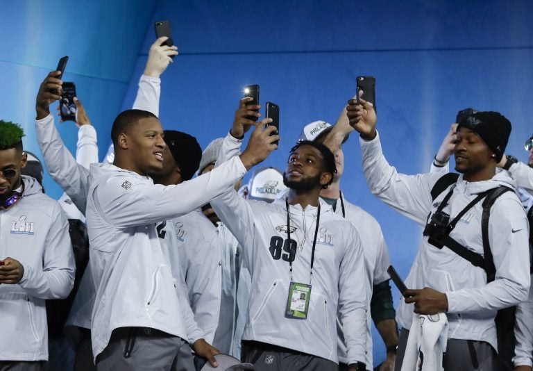 Philadelphia Eagles players take pictures during NFL football Super Bowl 52 Opening Night Monday, Jan. 29, 2018, at the Xcel Center in St. Paul, Minn.