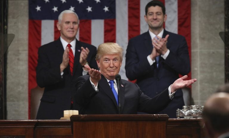 President Donald Trump gestures as delivers his first State of the Union address in the House chamber of the U.S. Capitol to a joint session of Congress Tuesday, Jan. 30, 2018 in Washington, as Vice President Mike Pence and House Speaker Paul Ryan applaud.
