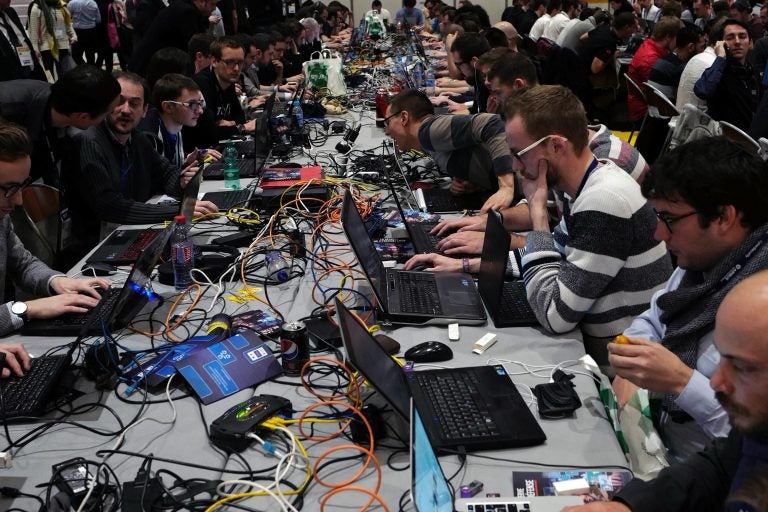 Hackers take part to a test at the Cybersecurity Conference in Lille, northern France, Wednesday Jan. 25, 2017.  (AP Photo/Michel Spingler)