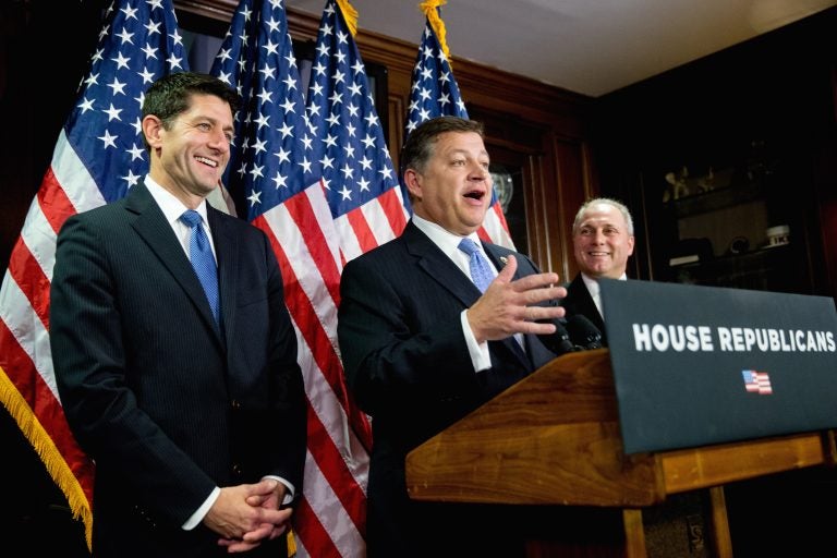 House Transportation Committee Chairman Rep. Bill Shuster, R-Pa., center, accompanied by House Speaker Paul Ryan of Wis., left, and House Majority Whip Steve Scalise of La., right, speaks during a news conference on Capitol Hill in Washington, Tuesday, Nov. 3, 2015.