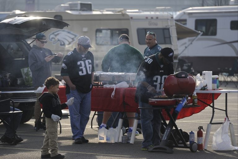 Fans tailgate before an NFL football game in Philadelphia.