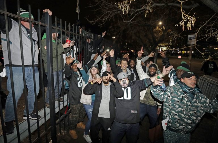 Fans celebrate outside Lincoln Financial Field after the NFL football NFC championship game between the Philadelphia Eagles and the Minnesota Vikings Sunday, Jan. 21, 2018, in Philadelphia. The Eagles won 38-7 to advance to Super Bowl LII. (Matt Slocum/AP Photo)
