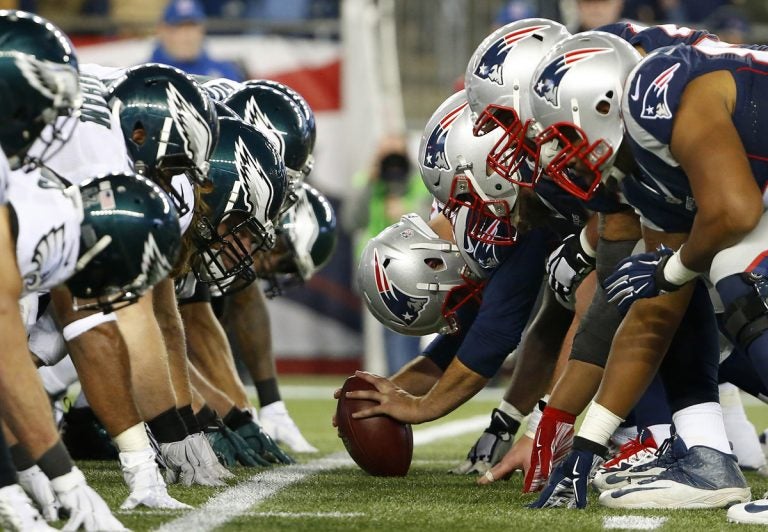 In this Dec. 6, 2015, file photo, the New England Patriots and the Philadelphia Eagles get set for the snap at the line of scrimmage during an NFL football game at Gillette Stadium in Foxborough, Mass. (Winslow Townson/AP Images for Panini via AP, File)