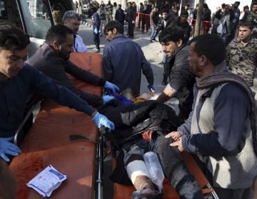 An injured man is moved to a stretcher outside a hospital following a suicide attack in Kabul, Afghanistan, Saturday Jan. 27, 2018. A suicide car bomber killed at least 40 people and wounded about 140 more in an attack claimed by the Taliban on Saturday in Afghanistan's capital Kabul, authorities said. (Rahmat Gul/AP Photo)