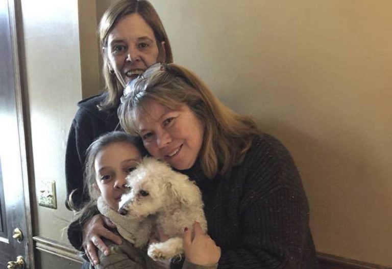 In this photo provided by Jessica Hartman, Monica Newhard, (right), and her granddaughter, Helen Welch, hold their pet bichon frise, Zoey, as the dog’s rescuer, Christina Hartman, stands behind them, Wednesday, Jan. 3, 2018, in Palmerton, Pa. Newhard’s brother says an eagle snatched Zoey from the yard. (Jessica Hartman via AP)