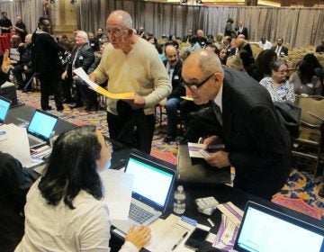 Job applicants interact with screening staff during a hiring event for the soon-to-open Hard Rock casino on Tuesday Jan. 30, 2018 in Atlantic City N.J. Hard Rock, which used to be the Trump Taj Mahal, held the recruiting event for former Taj workers. The former Revel casino is reopening around the same time as well as the Ocean Resort casino, adding thousands of jobs to a market that lost 11,000 since 2014 due to casino closings. (Wayne Parry/AP Photo)