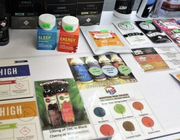 The bottles that say Stratos are capsules filled with cannabis for a sleeping or for energy. (Bill Barlow for WHYY) 