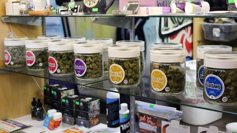 Like an old fashioned candy store varieties of marijuana are display in jars. (Bill Barlow/for WHYY)