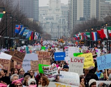 Protestors march down the Ben Franklin Parkway during the Women's March on Philadelphia