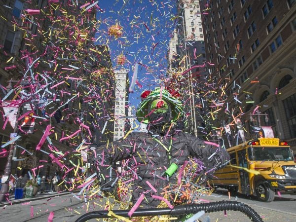 Brendan Ireland, a member of Philadelphians for Mummery tossed confetti as he marched the parade route.