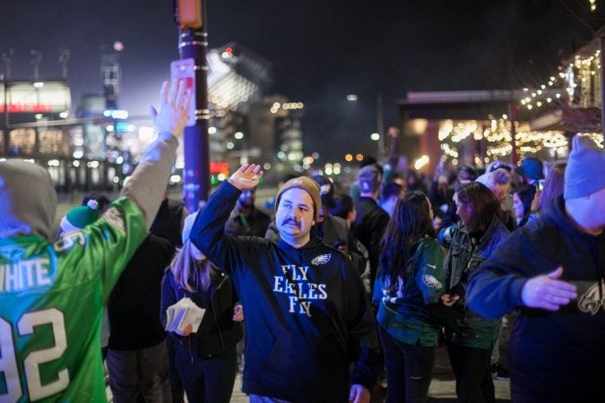 Eagles Fans celebrate near Xfinity Live. (WHYY)