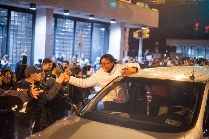 Eagles Fans celebrate on South Broad Street after their win over the Minnesota Vikings in the NFC Championship Game Sunday. (Brad Larrison for WHYY)