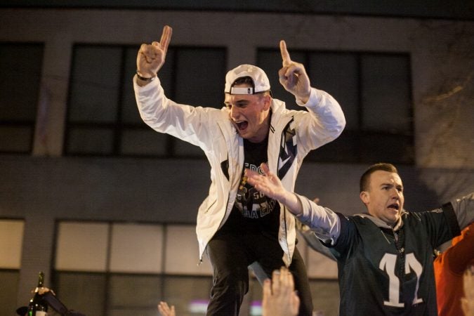 Eagles Fans celebrate on South Broad Street after their win over the Minnesota Vikings in the NFC Championship Game Sunday. (Brad Larrison for WHYY)