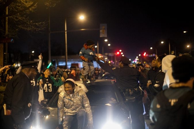 Eagles Fans celebrate on South Broad Street after their win over the Minnesota Vikings in the NFC Championship Game Sunday. (Brad Larrison for WHYY)