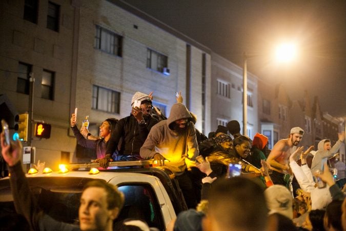 Eagles Fans celebrate on South Broad Street after their win over the Minnesota Vikings in the NFC Championship Game Sunday. (Brad Larrison for WHYY)