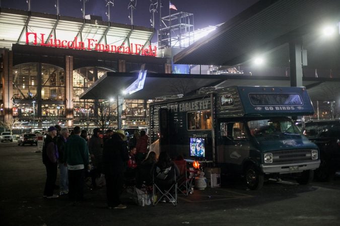 Eagles fans watch the NFC Championship Game against the Minnesota Vikings from their R.V in the parking lot of Lincoln Financial Field Sunday night. (Brad Larrison for WHYY)