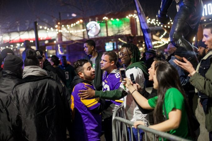 A minor scuffle between Eagles and Vikings fans outside of Xfinity LIve after the NFC Championship Game at Lincoln Financial Field Sunday Night. (Brad Larrison for WHYY)