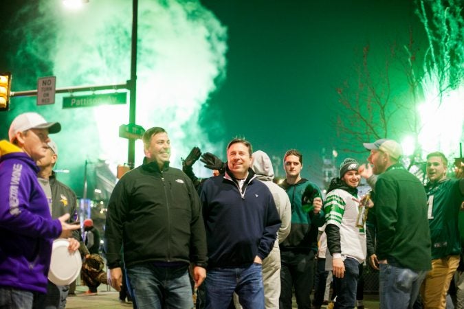 Eagles fan walk down Pattison Avenue in South Philadelphia following their win over the Minnesota Vikings in the NFC Championship Game Sunday Night. (Brad Larrison for WHYY)