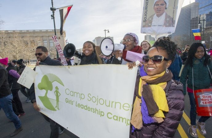 Camp Soujourner members march down the Parkway. (Jonathan Wilson for WHYY)