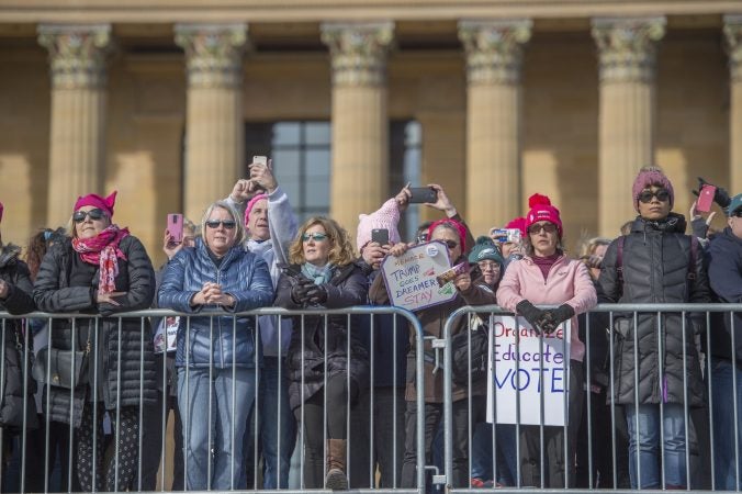 Marchers gather at the top of the Philadelphia Art Museum steps to watch the speakers below. (Jonathan Wilson for WHYY)