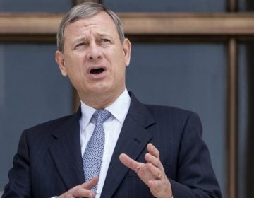 Chief Justice John Roberts stands outside the Supreme Court in Washington, D.C., in June, following new Associate Supreme Court Justice Neil Gorsuch investiture ceremony, a ceremony to mark his ascension to the bench.