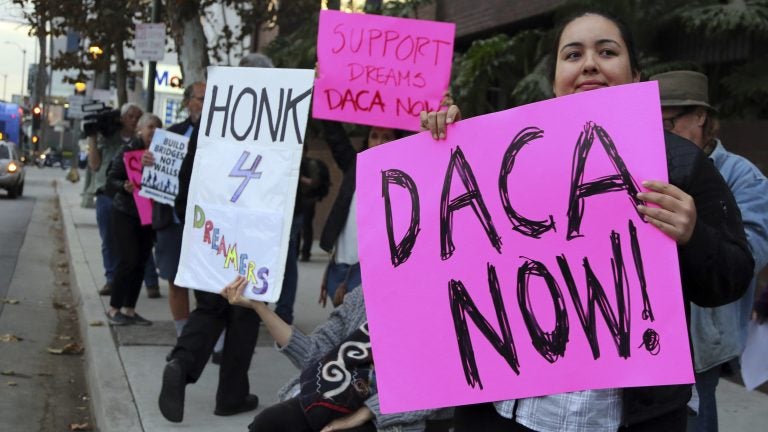 Demonstrators urging the Democratic Party to protect the Deferred Action for Childhood Arrivals Act (DACA) rally outside the office of California Democratic Sen. Dianne Feinstein in Los Angeles last week.
