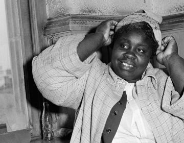 Georgia Gilmore adjusts her hat for photographers in 1956 during the bus boycott trial of Rev. Martin Luther King Jr. in Montgomery, Ala. She testified: 