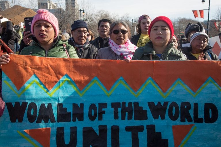 Immigrants stand together at the 2018 Women's March on Philadelphia Saturday. (Emily Cohen for WHYY)