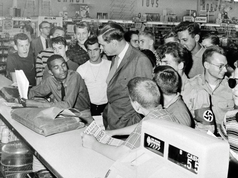 Dion Diamond listens with his eyes closed to George Lincoln Rockwell, the founder of the American Nazi Party, at a 