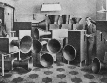 The futurist artist Luigi Russolo (left)  with his noise machine, invented for futurist 