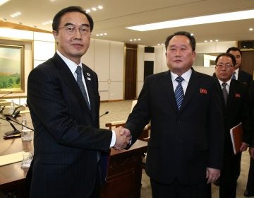 South Korea's Unification Minister Cho Myung-gyun, (left), shakes hands with North Korean chief delegate Ri Son Gwon after their meeting at the village of Panmunjom in the Demilitarized Zone dividing the two Koreas, on Tuesday. (AFP Photo / Korea pool/AFP/Getty Images)