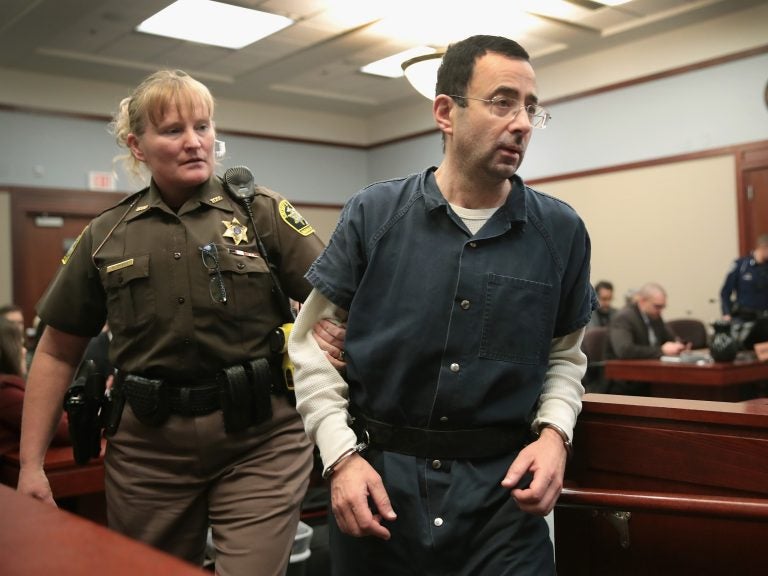 Larry Nassar appears in court last Wednesday in Lansing, Mich., to listen to victim impact statements during his sentencing hearing. He is accused of molesting more than 100 girls while he was a physician for USA Gymnastics and Michigan State University.