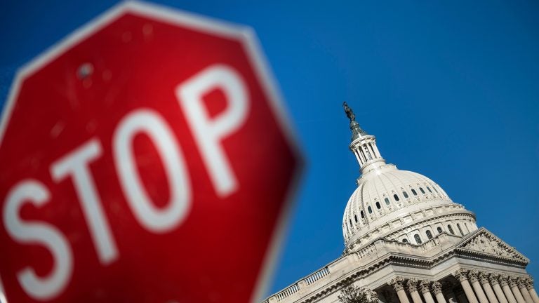 Capitol Hill is seen against a blue sky Saturday, the first day of the partial government shutdown (Brendan Smialowski/AFP/Getty Images)