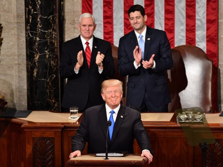 President Trump listens to applause before delivering his State of the Union address Tuesday night at the Capitol in Washington